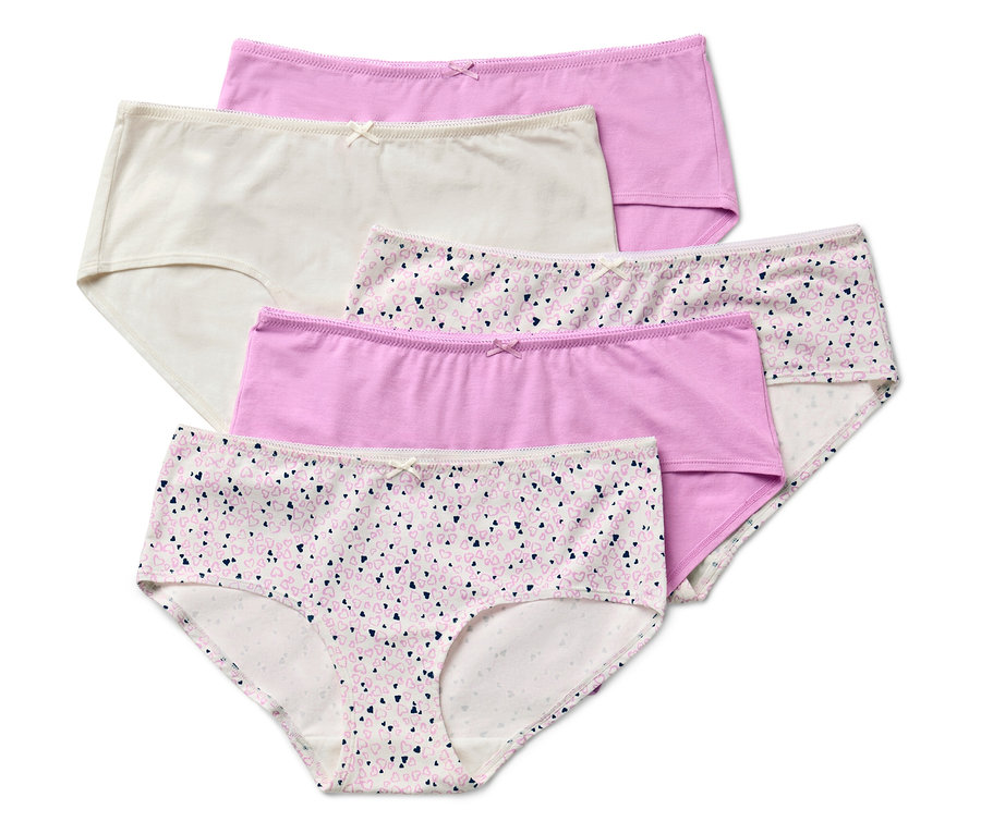 Pět dámských kalhotek různých barev a vzorů leží na sobě.