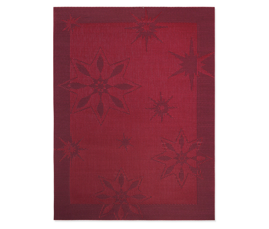 Červený prostírání s motivem hvězdy.