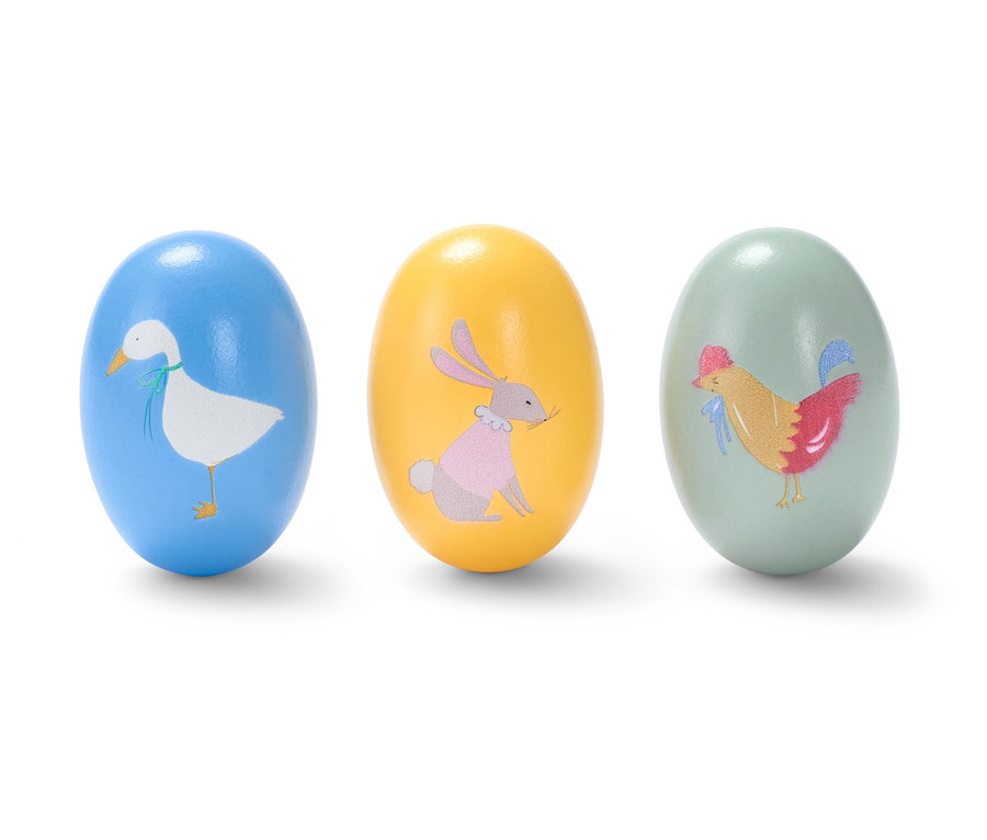 Tři chrastící vajíčka s obrázky zvířat.