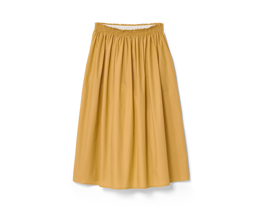 Žlutá sukně NAH/STUDIO z biobavlny s elastickým pasem na bílém pozadí.