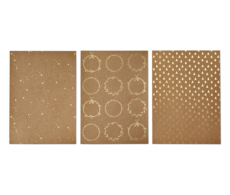 Sada sulfátového papíru se vzory hvězd, věnců a trojúhelníků.