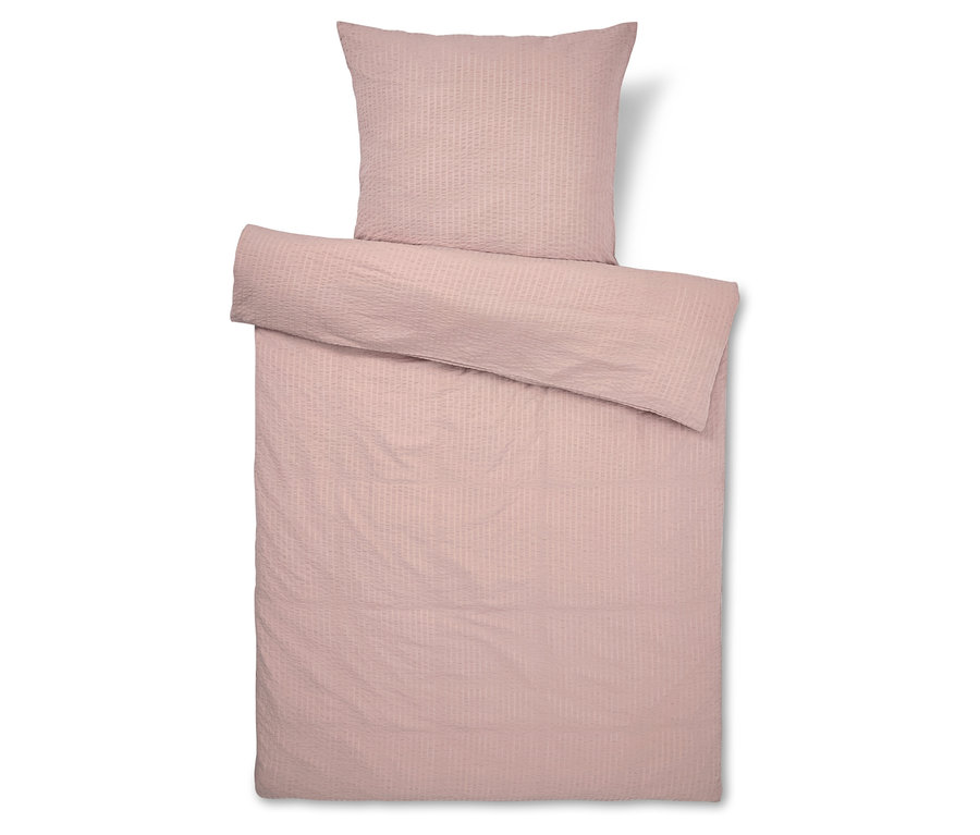 Růžové povlečení s proužky, včetně povlaku na polštář.