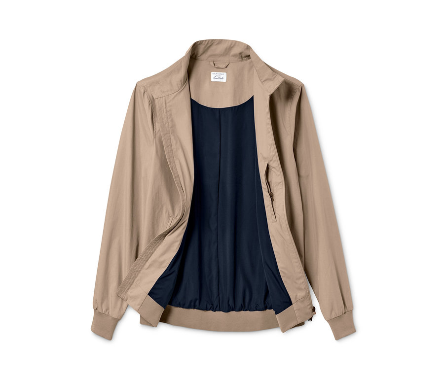 Béžový bluzon s tmavě modrou podšívkou.