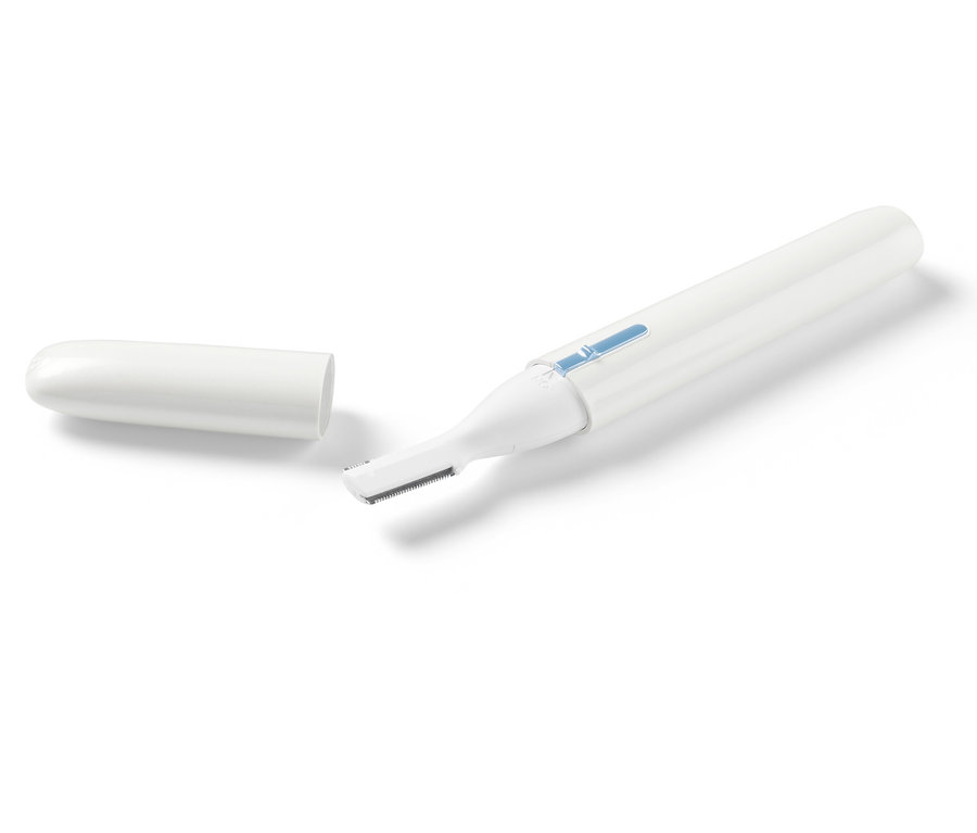 Elektrický kosmetický holicí strojek s odděleným krytem.