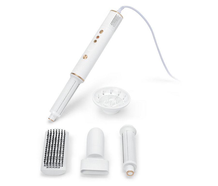 Bílý multifunkční stylingový nástroj na vlasy s různými nástavci na bílém pozadí.