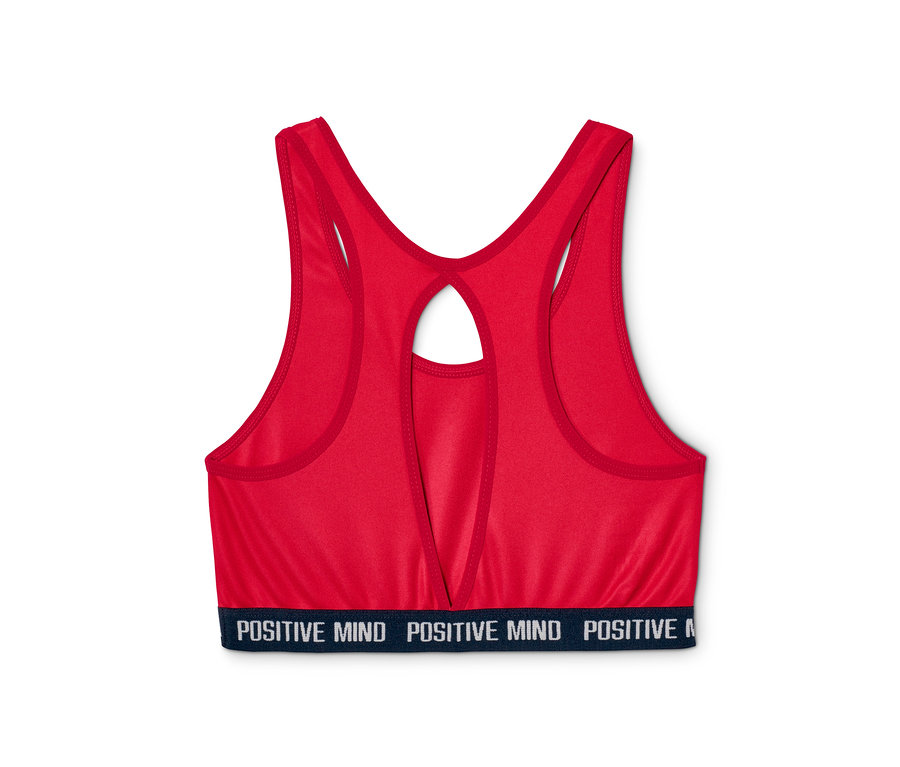 Detail červené sportovní podprsenky z 2 ks soupravy s nápisem "POSITIVE MIND" na spodním lemu.