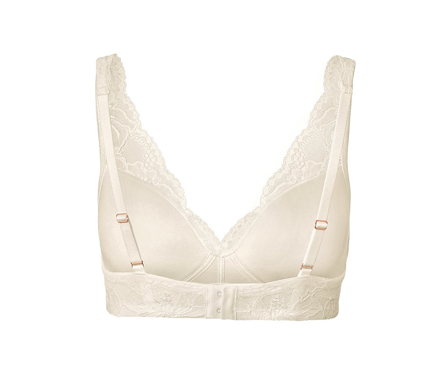 Detail krémové podprsenky s měkkými košíčky, pohled zezadu.