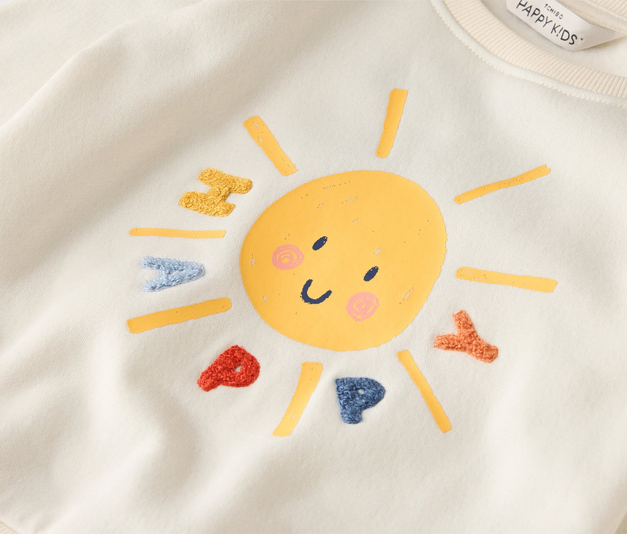 Krémová mikina s usměvavým sluncem a nápisem HAPPY.