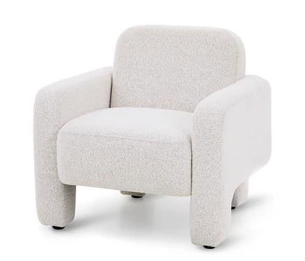 Krémové buklé křeslo s oblým, moderním designem, tlustými područkami a krátkými, zaoblenými nohami.