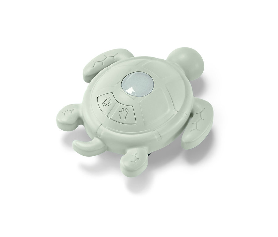 Zelený časovač na mytí rukou a čištění zubů ve tvaru želvy.