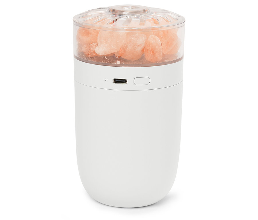 Bílá lampa s růžovými krystaly soli v průhledném vršku.