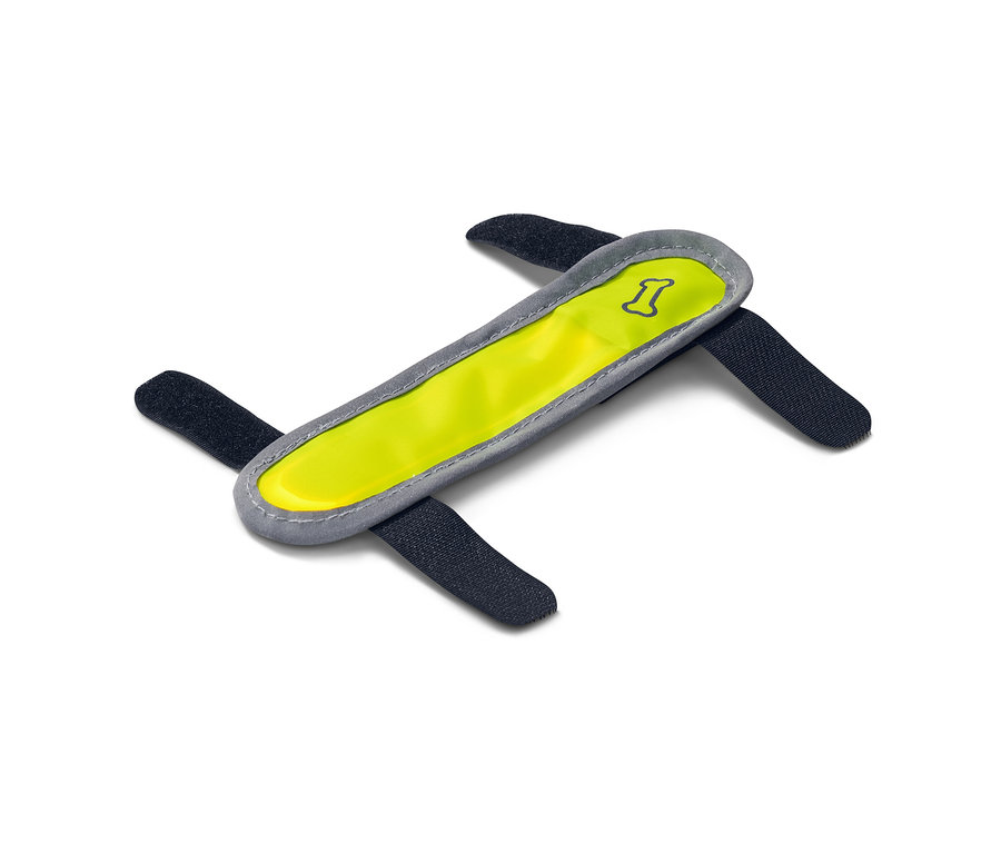 Žlutý svítící LED pásek pro psy se čtyřmi černými upevňovacími popruhy na bílém pozadí.