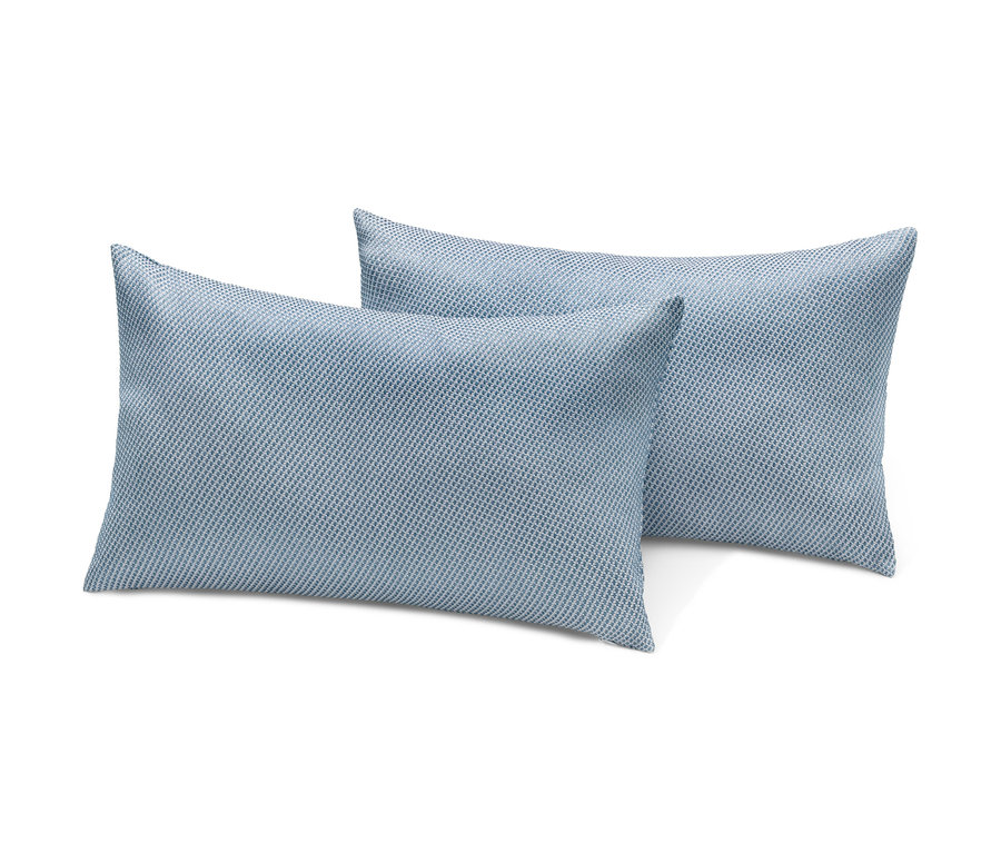 Dva venkovní polštáře s tkanou strukturou.