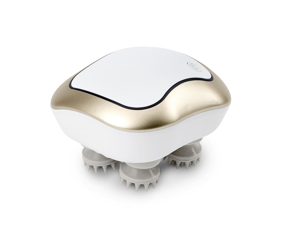 Masážní přístroj v bílo-zlaté barvě s hroty na spodní straně.