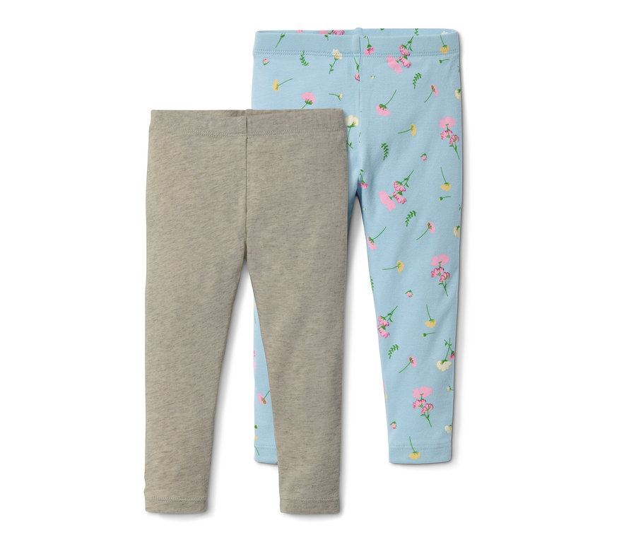 Dvoje legín z biobavlny: jedny šedé a druhé světle modré s květinovým potiskem.