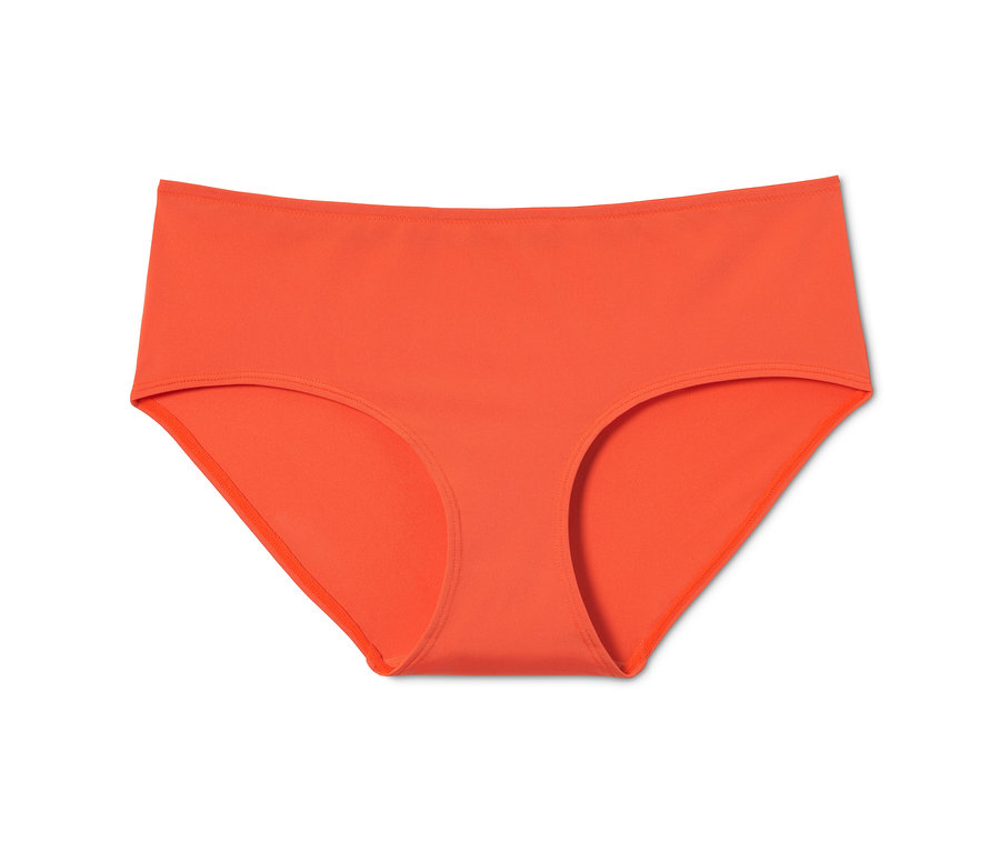 Oranžové kalhotky, 3 ks, na bílém pozadí.