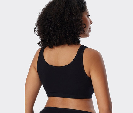 Zezadu pohled na ženu s tmavými vlasy v černé podprsence Schiesser s bio bavlnou, 2 ks.