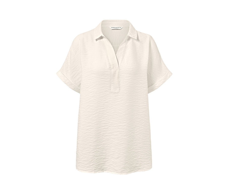 Krémová halenka s krátkými rukávy.