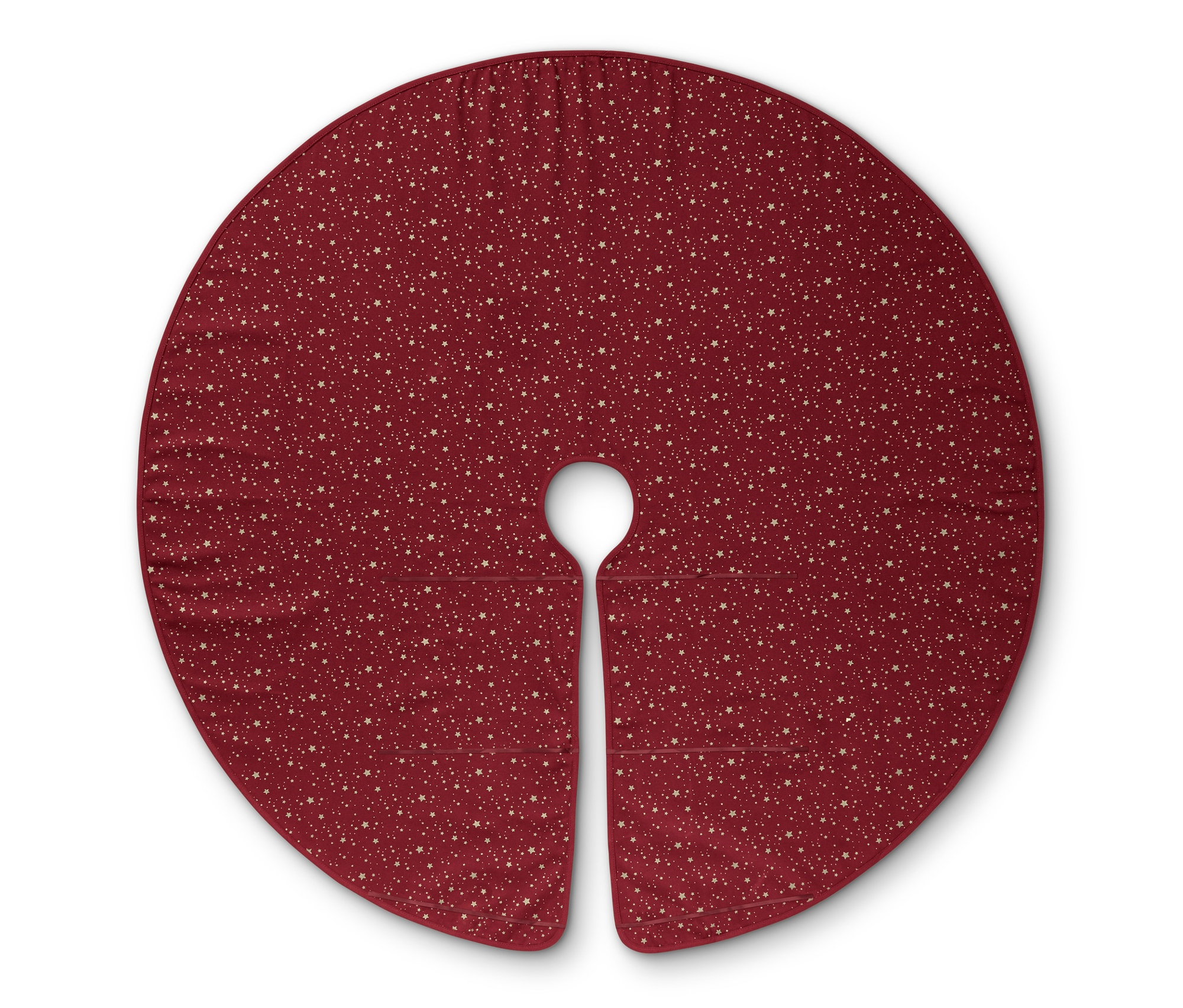 Červená deka pod vánoční stromeček s hvězdami.