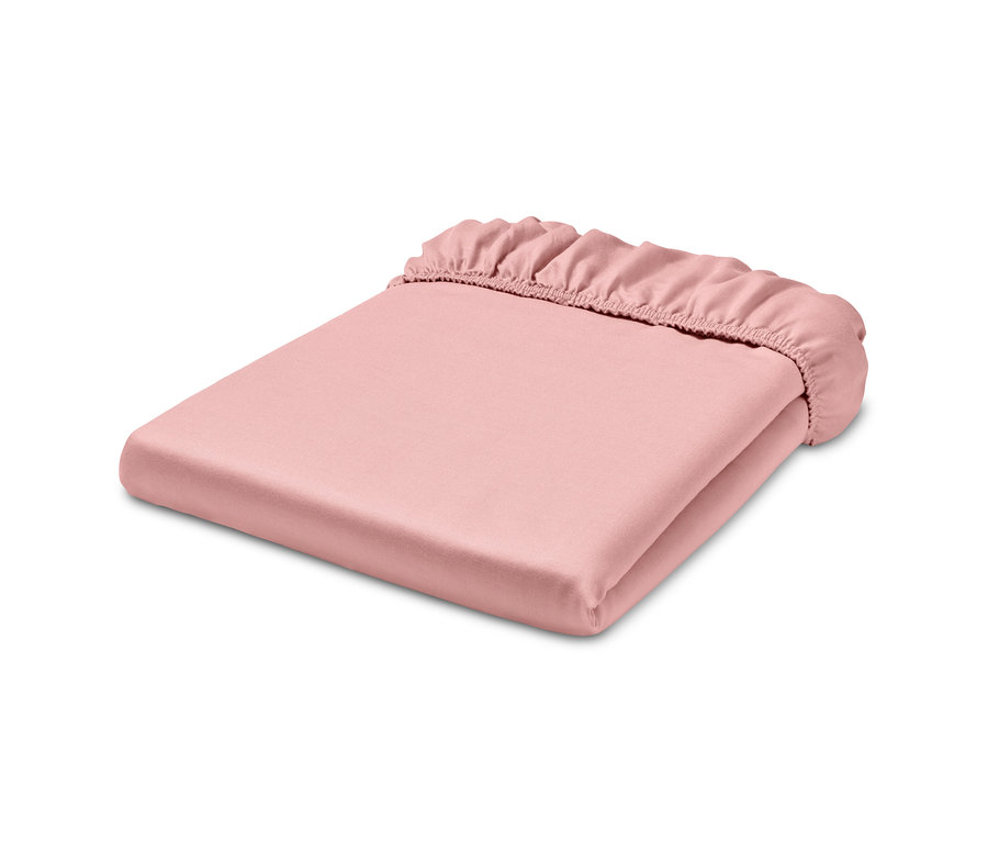 Složené růžové bavlněné napínací prostěradlo s vláknem Tencel™.