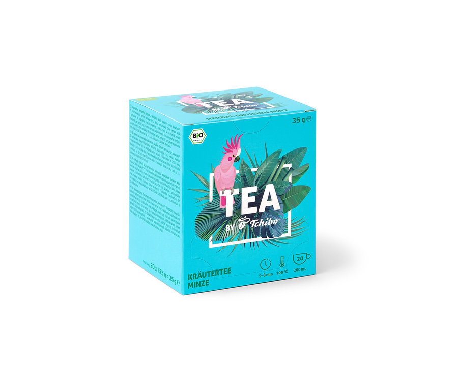 Balení BIO TEA by Tchibo máta s obrázkem kakadu a tropických listů.