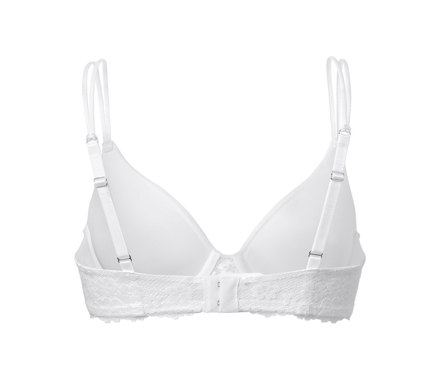 Detail bílé podprsenky s kosticemi, pohled zezadu.