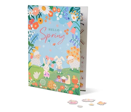 Ilustrace knihy s názvem "Hello Spring" s ovcemi, králíky, květinami a piknikovou dekou.