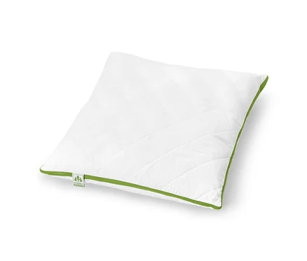 Bílý polštář irisette® greenline s klimatickým pásem leží na bílém pozadí.