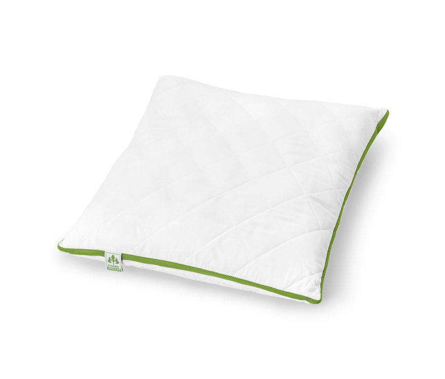 Bílý polštář irisette® greenline s klimatickým pásem leží na bílém pozadí.