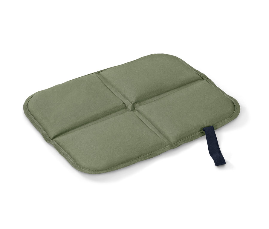 Zelený skládací termopolštářek na sezení.