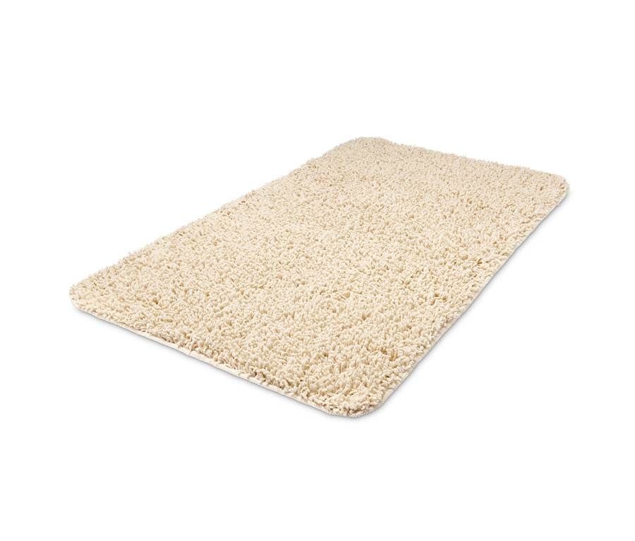 Vanilková koupelnová předložka z recyklovaného materiálu o rozměrech cca 70 x 120 cm.