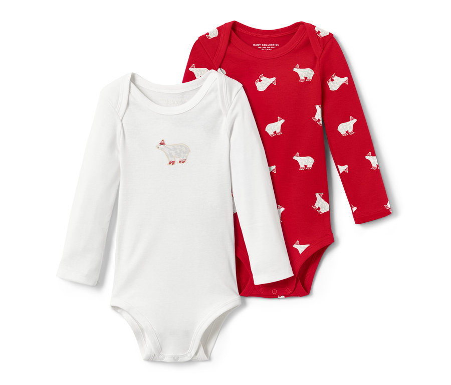 Dvě dětská body s dlouhým rukávem: jedno bílé s obrázkem ledního medvěda, druhé červené s potiskem ledních medvědů.