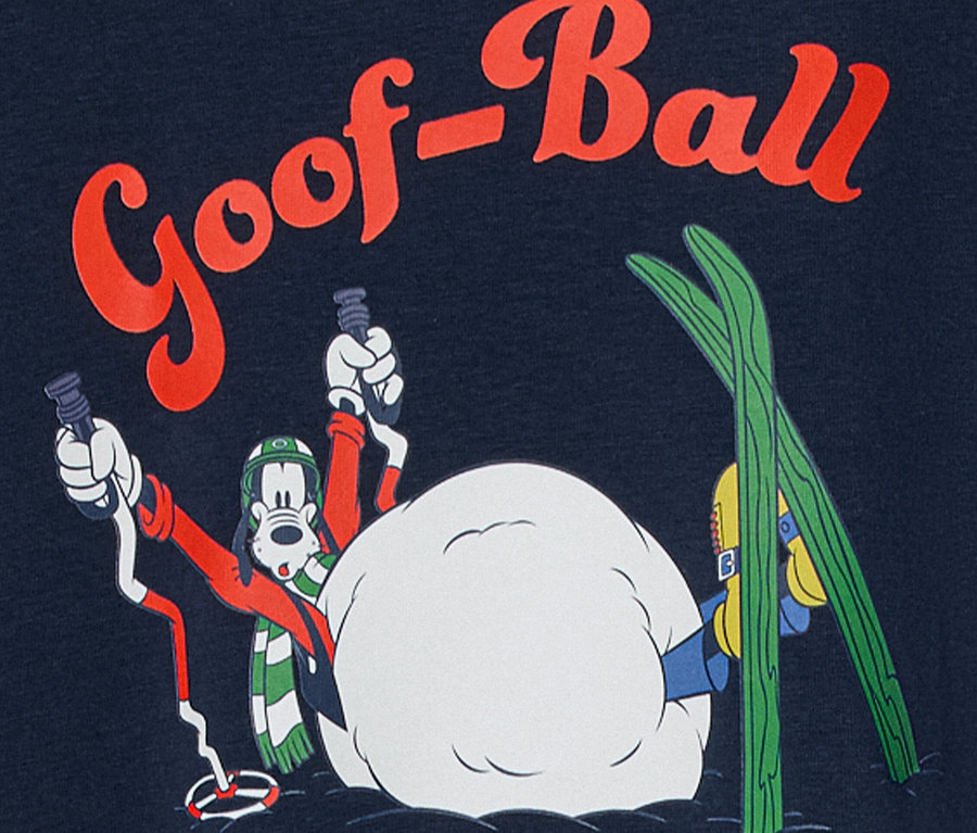 Kreslená postavička Goofy s lyžařskou výbavou v zasněžené scéně s nápisem "Goof-Ball".