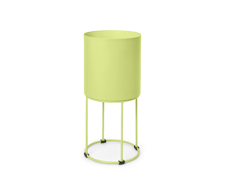Zelený kulatý květináč na podstavci.