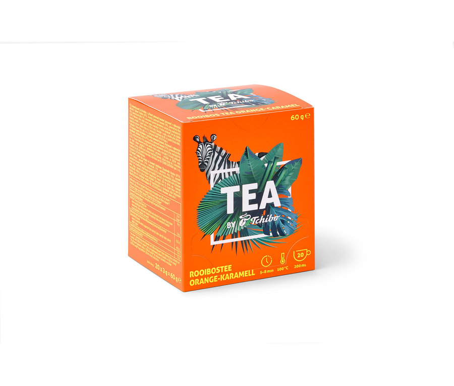 Oranžová krabička čaje Rooibos TEA by Tchibo s příchutí pomeranč/karamel – 8 × 20 nálevových sáčků.