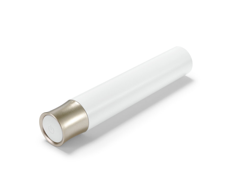 Elektrický zastřihovač obočí bílé barvy s zlaceným detailem.