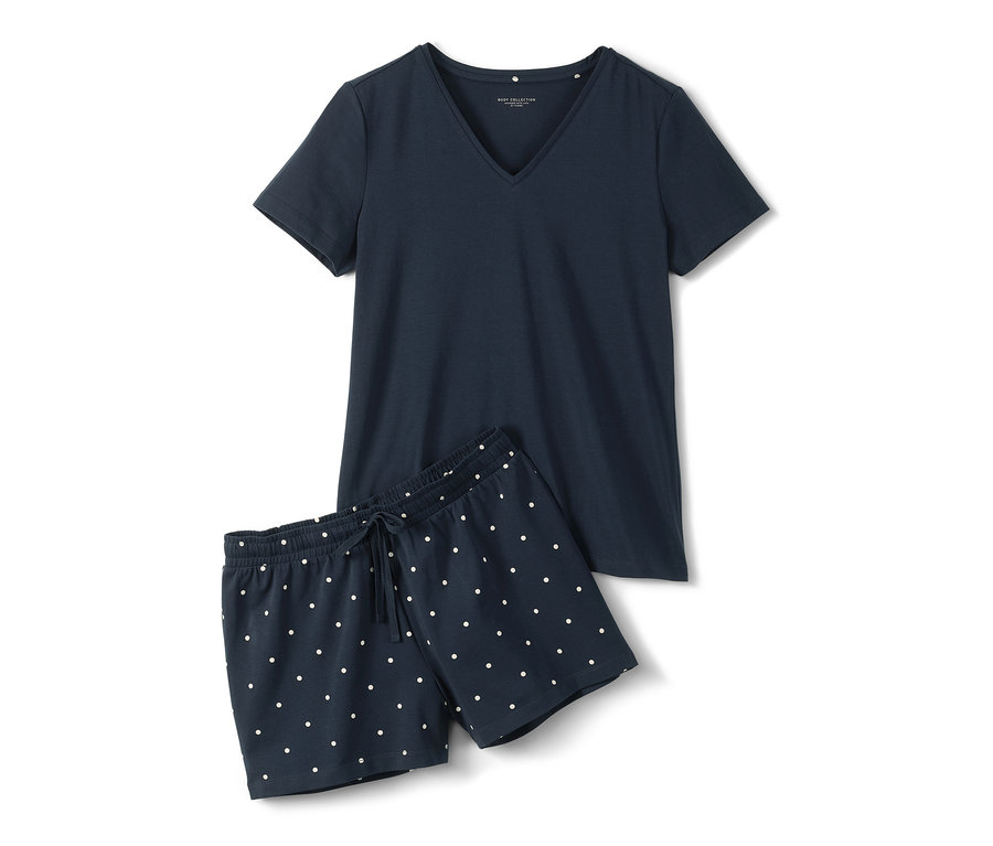 Tmavě modré krátké pyžamo s bílými puntíky.