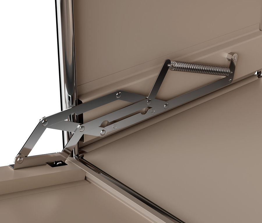 Detail hnědošedé kovové skříňky »CN3« s výklopnými dvířky a kovovým mechanismem.