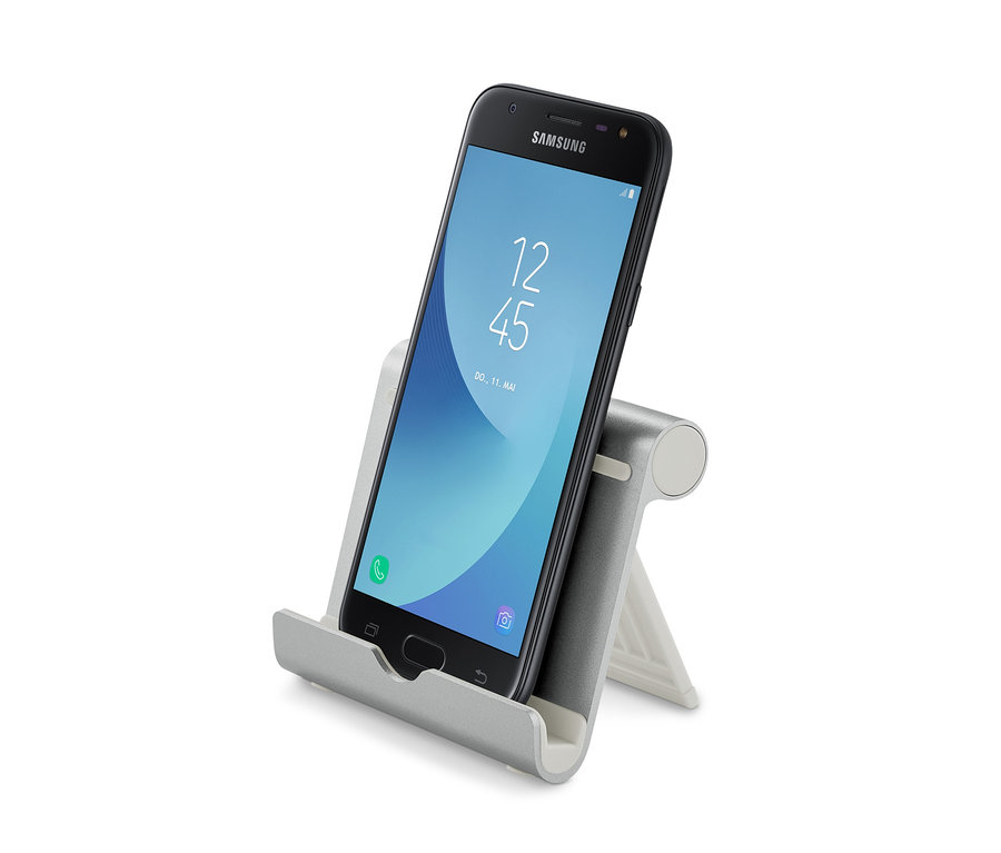 Černý smartphone je umístěn v šedém stojanu na smartphone a tablet.