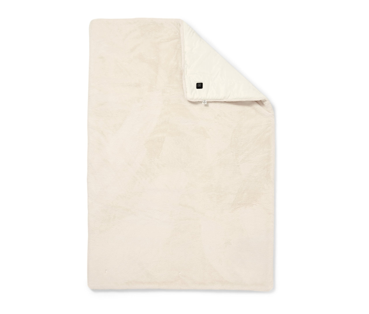 Béžové vyhřívané pončo na baterie složené na bílém pozadí.