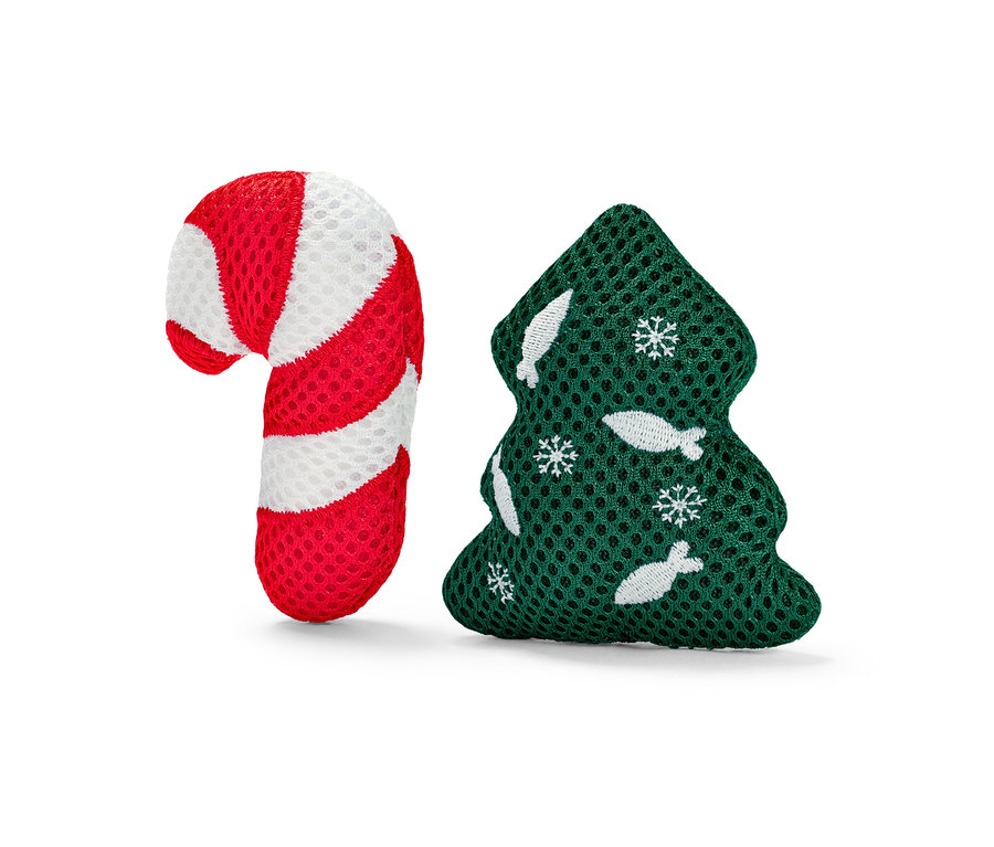 Hračka pro kočky ve tvaru cukrové třtiny červeno-bílé barvy a zeleného vánočního stromku.