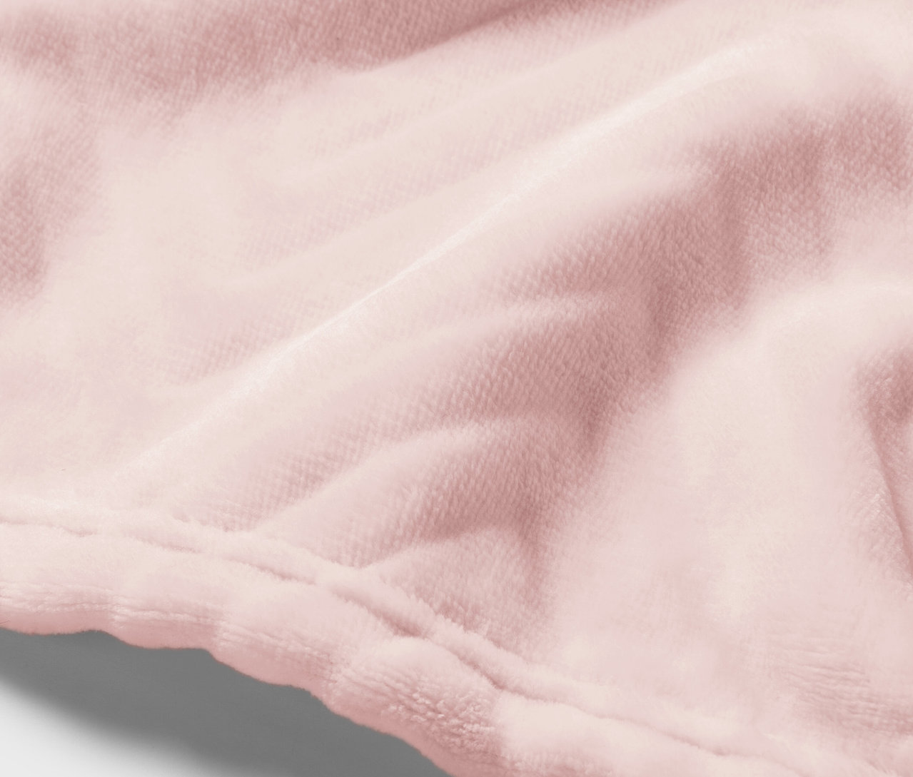 Detail růžové sametové látky se švem.