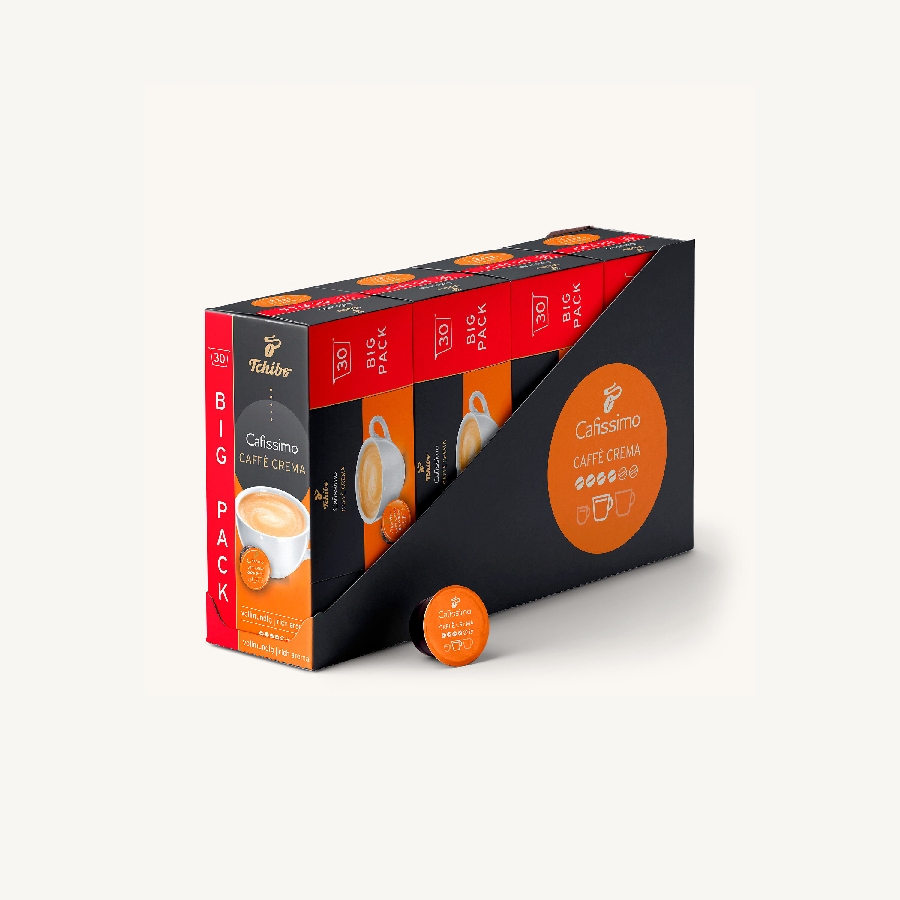 Balení kávových kapslí Cafissimo Caffe Crema v černém držáku a jedna kapsle před ním.