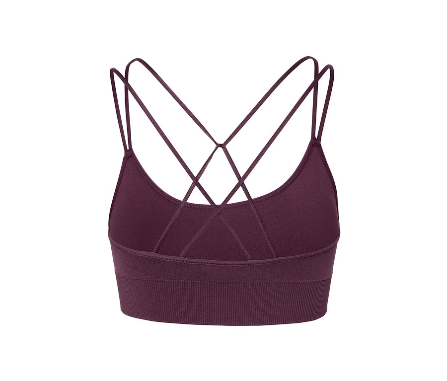Detail fialové sportovní podprsenky Bezešvá sportovní podprsenka se zkříženými ramínky na zádech.