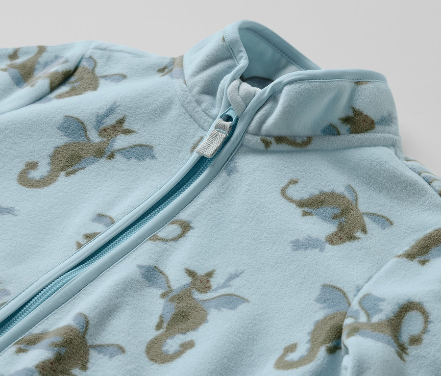 Světle modrá fleecová bunda Dětská fleecová bunda, dráček, s celoplošným potiskem draka a zipem.