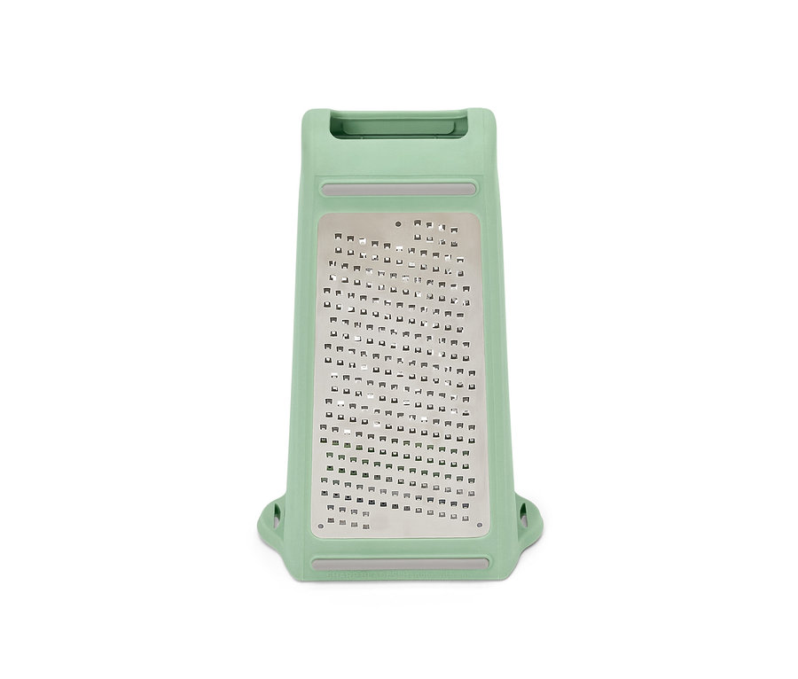 Zelené obousměrné struhadlo se záchytnou nádobkou na bílém pozadí.