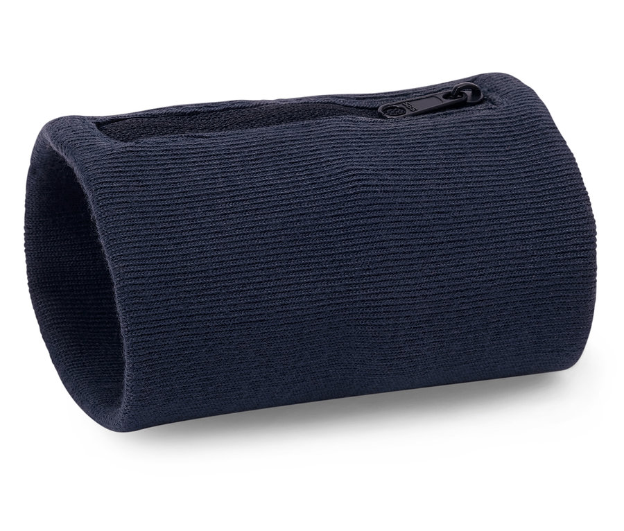Na bílém povrchu leží tmavě modrá zápěstní bandáž se zipem.