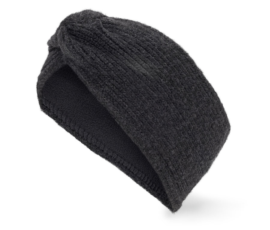 Černá pletená čelenka do vlasů s uzlem na bílém pozadí.