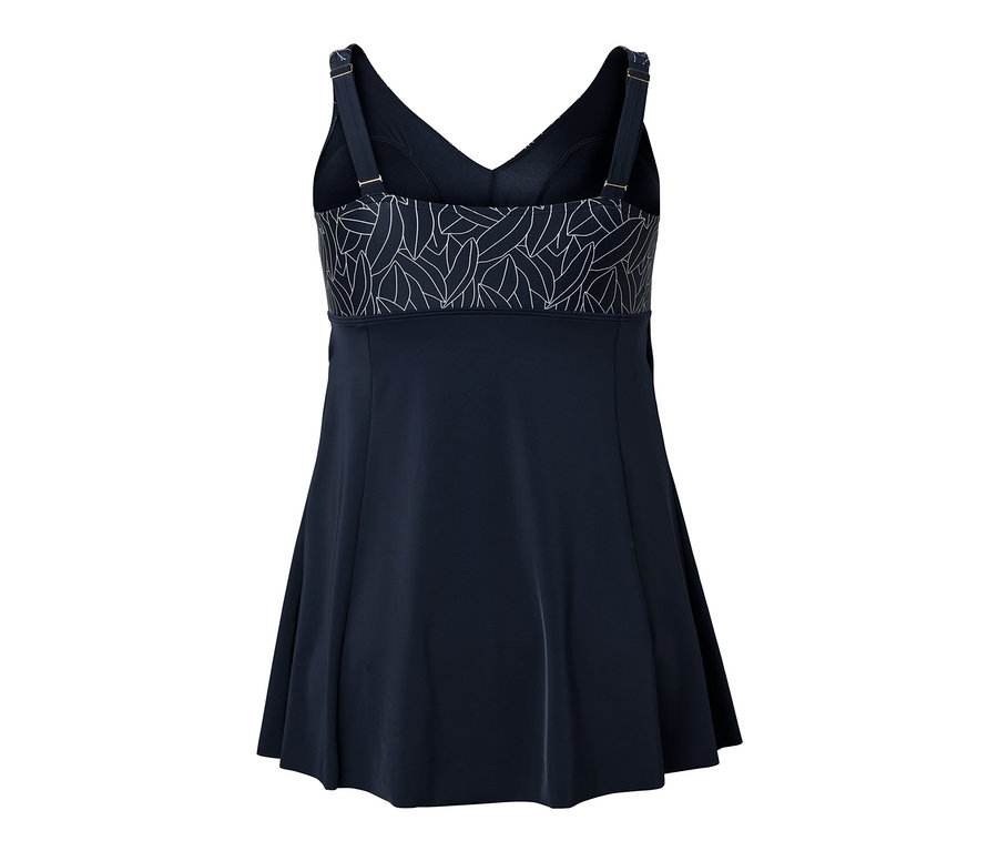 Detailní pohled zezadu na plavkové šaty s bílým listovým vzorem na horní části.